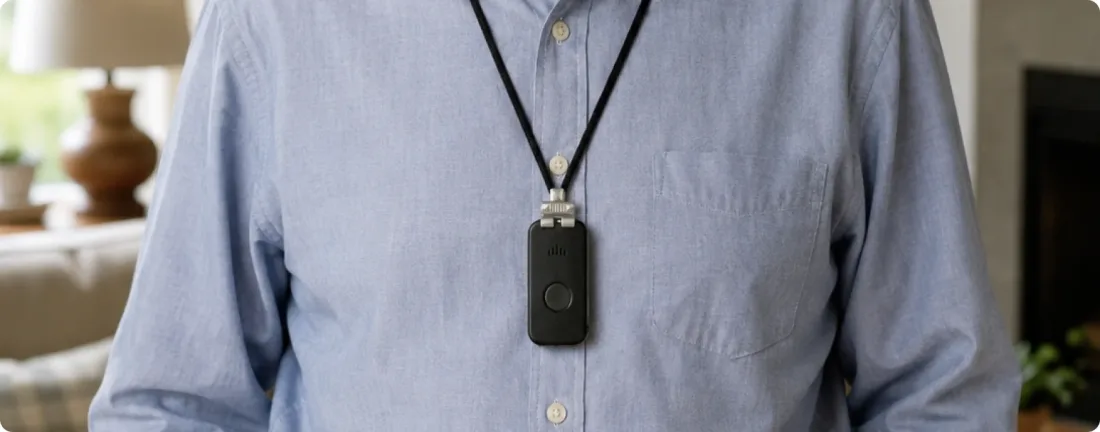 An older man wearing the DDD Pendant over a shirt.